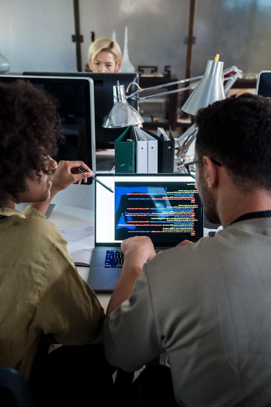 Team collaborating on software project in modern office